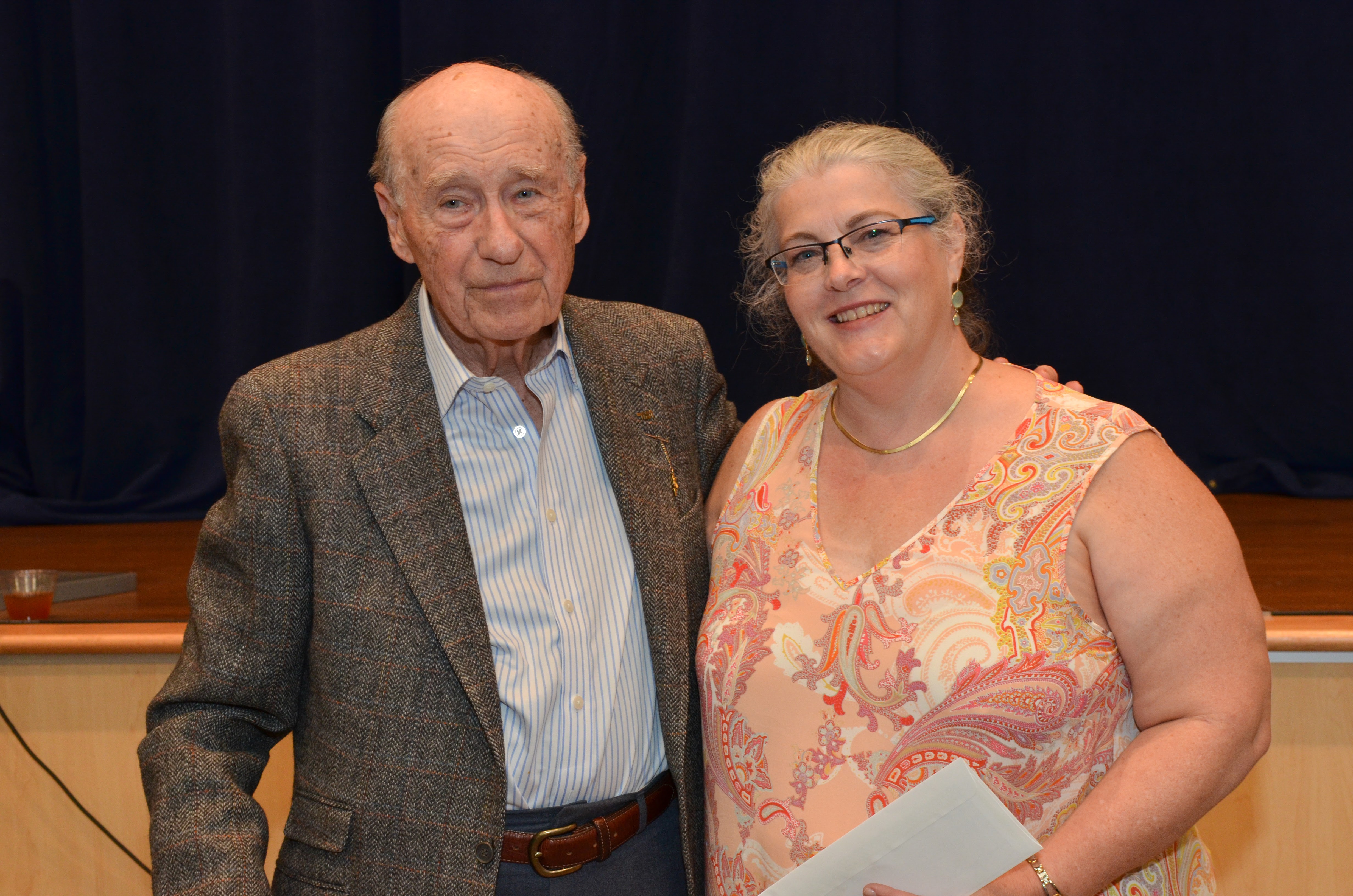 Al Silverstein presents the Silverstein Grant to Jamie Droste of the Foxboro Regional Charter School to support the Holocaust Stamps Project